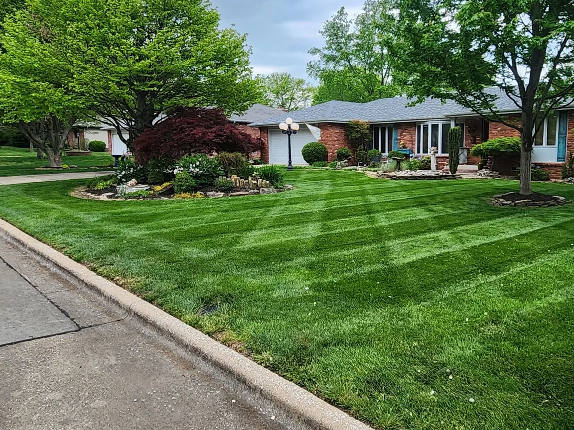Mowing lines meeting a clean curb edge